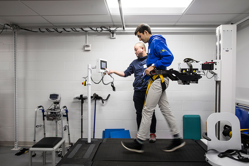 Student walking on treadmill