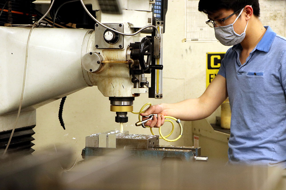 Student working with machinery