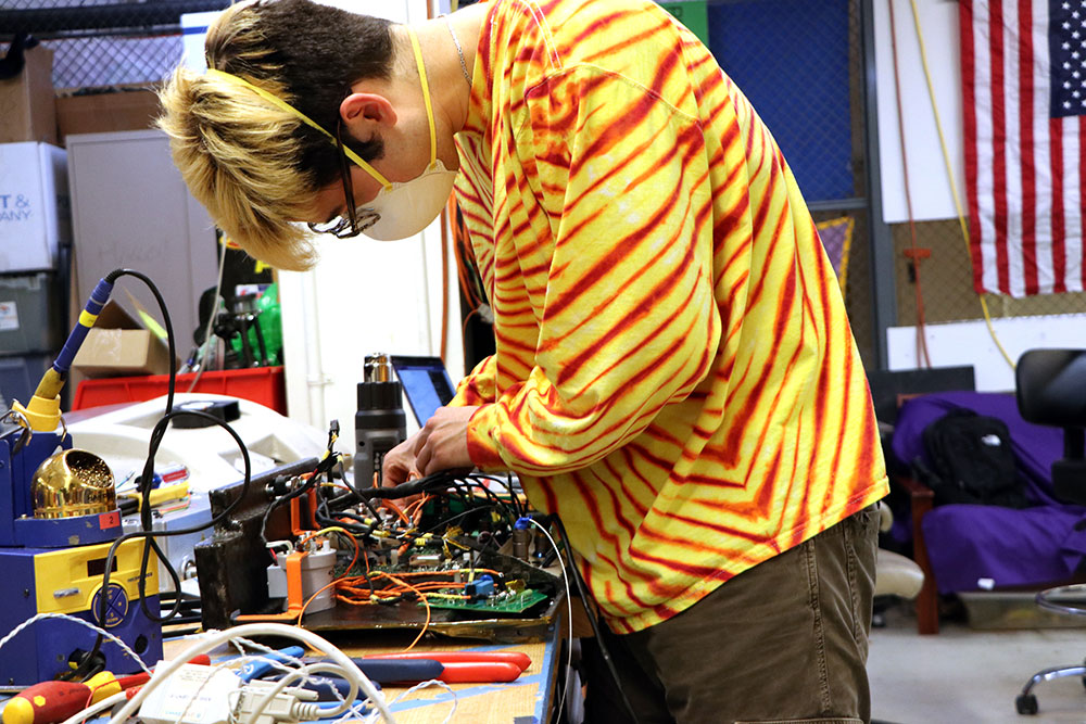 Student working with electrical wires