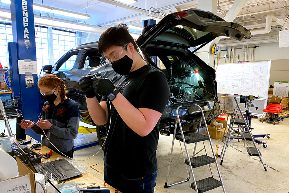 Student working with machinery