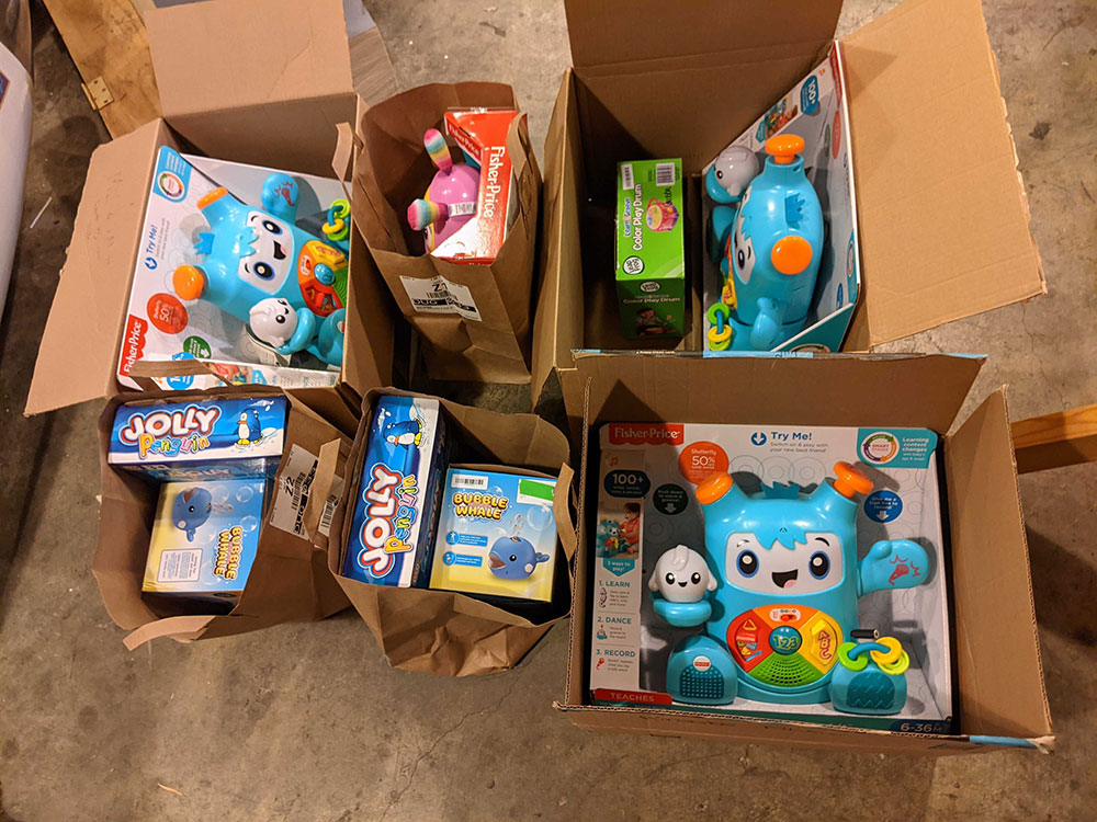 Boxes and paper bags filled with toys