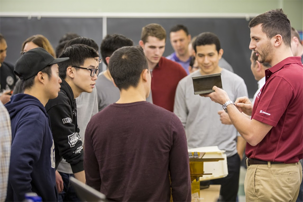 A&A alumnus Gianmarco Tartaglione shares a composite member of the wing box structure with students