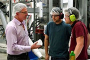 MicroGREEN production workers. Photo credit: Dan Bates, Everett Herald