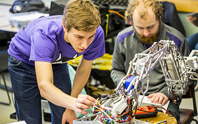 Student reviewing a mechanical device