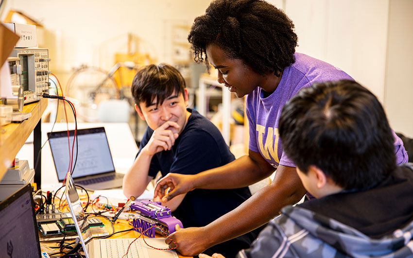 Students discussing in a lab