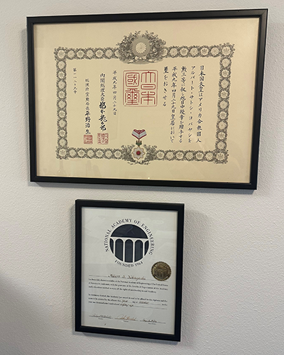 Two awards framed on a wall