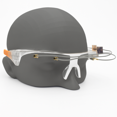 A glasses frame with sensors attached on a model of a head.