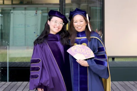 Doris Hung with Professor Corie L. Cobb in graduation gowns