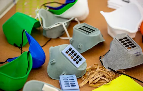 Multiple 3D-printed masks on a table