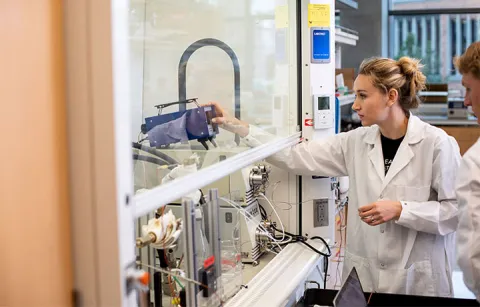 Elizabeth Rasmussen adjusts device setting