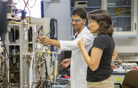 Tami Bond in lab with researcher