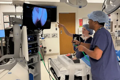 Two people conduct an experiment in a hospital setting