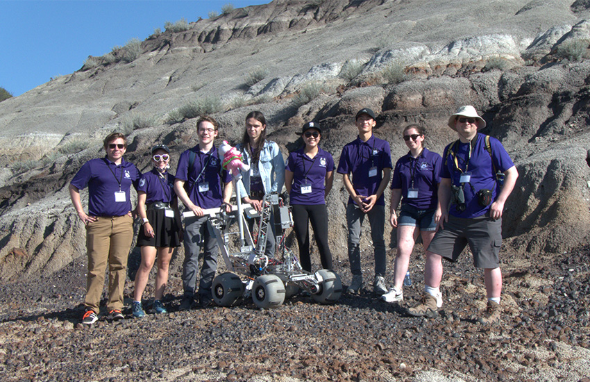 A photo of the UW Husky Robotics team with their robot at the Canadian International Rover Challenge.