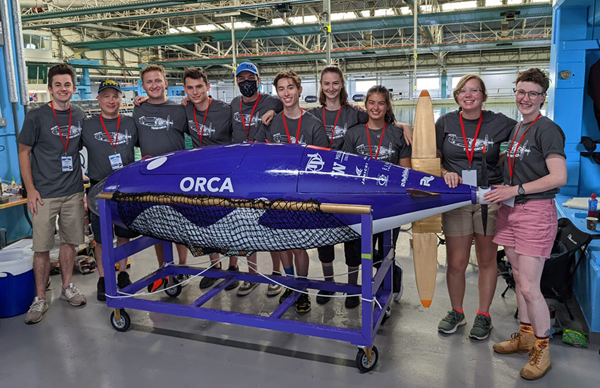 The UW Human Powered Submarine team members with their submarine at the European International Submarine Races competition.