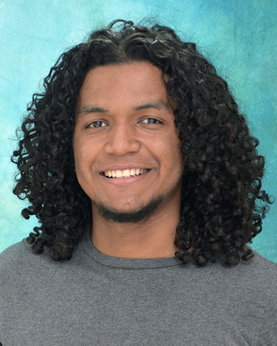 Juampablo Heras Rivera smiles in a headshot photo