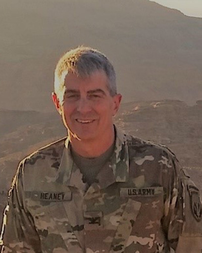Dennis Heaney wears a U.S. Army uniform in a camouflage pattern