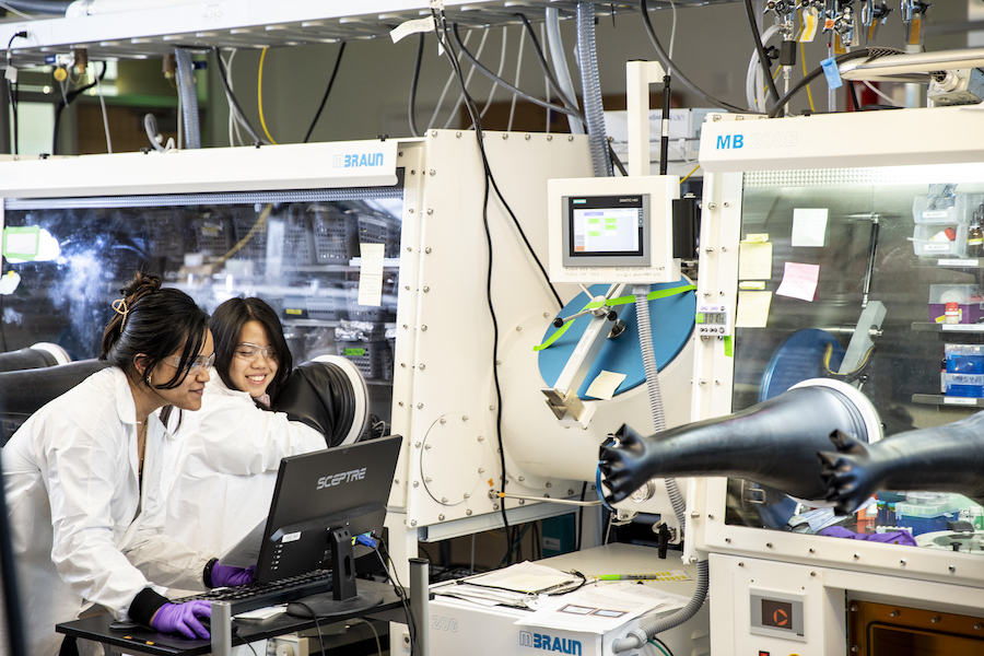 Two women looking at a computer in a lab