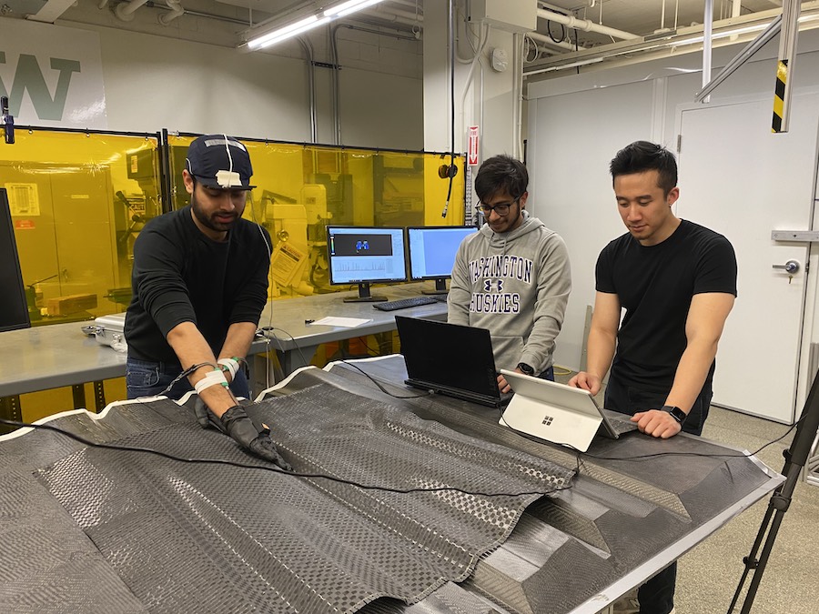 Three male students in a lab