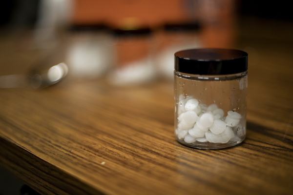 Close up of a jar with small plastic pieces of different sizes