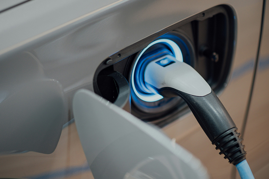 a close up of a plug in an electric car