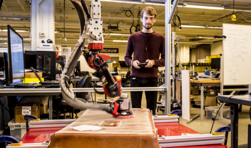 photo of student using a robotic arm