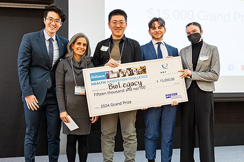 Group of people holding an award check