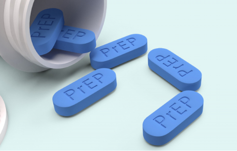 Pills labeled PrEP spill out of a pill bottle